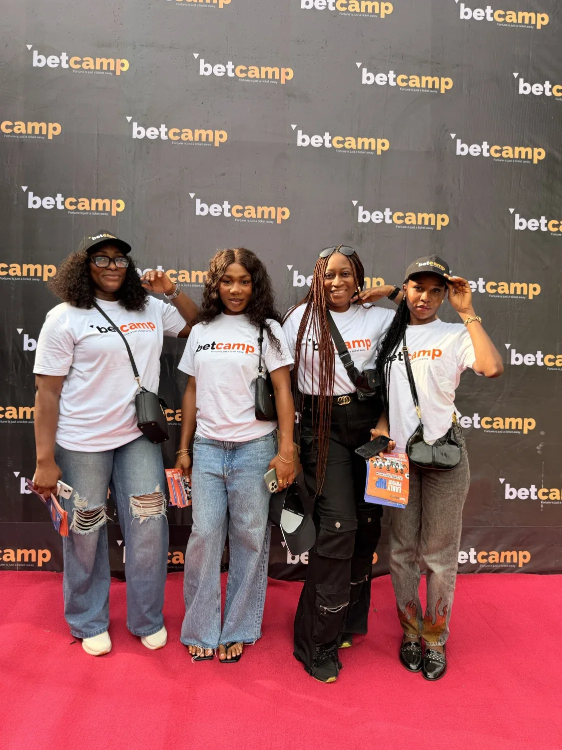 Betcamp event attendees together against a branded backdrop