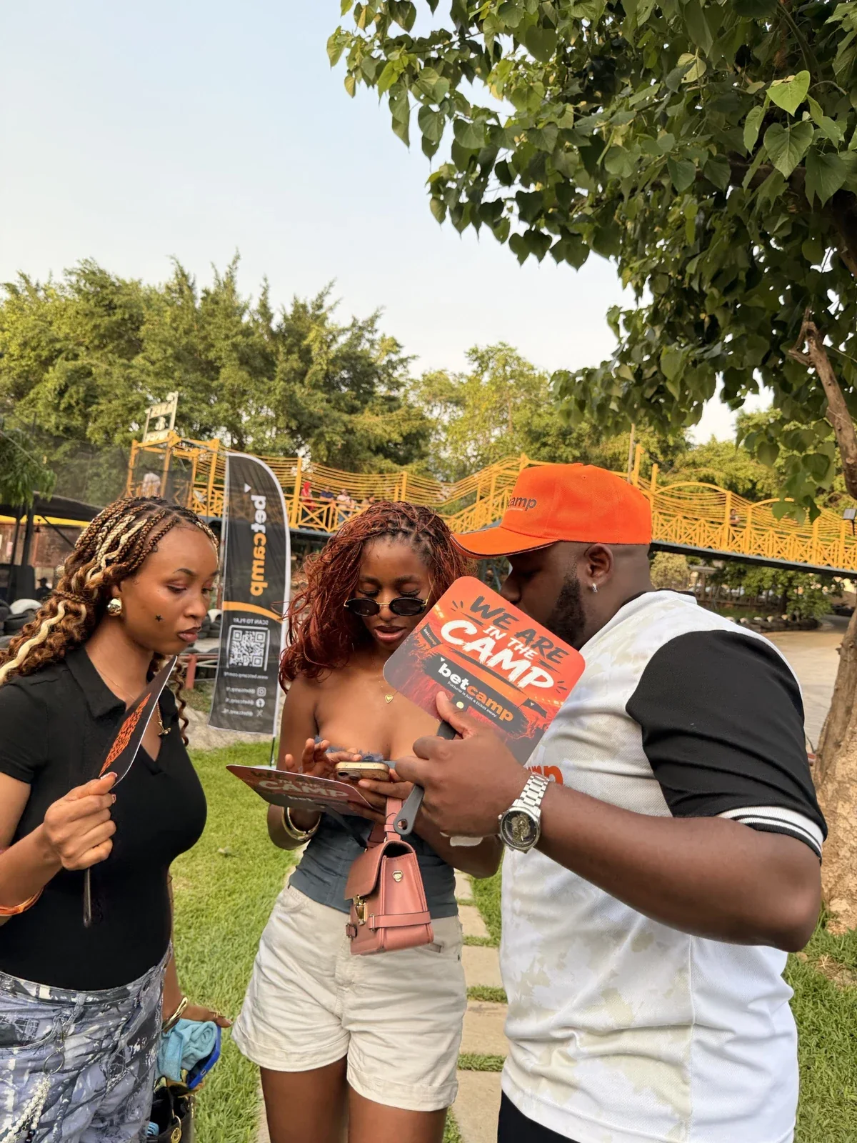 Attendees in conversation at an outdoor event